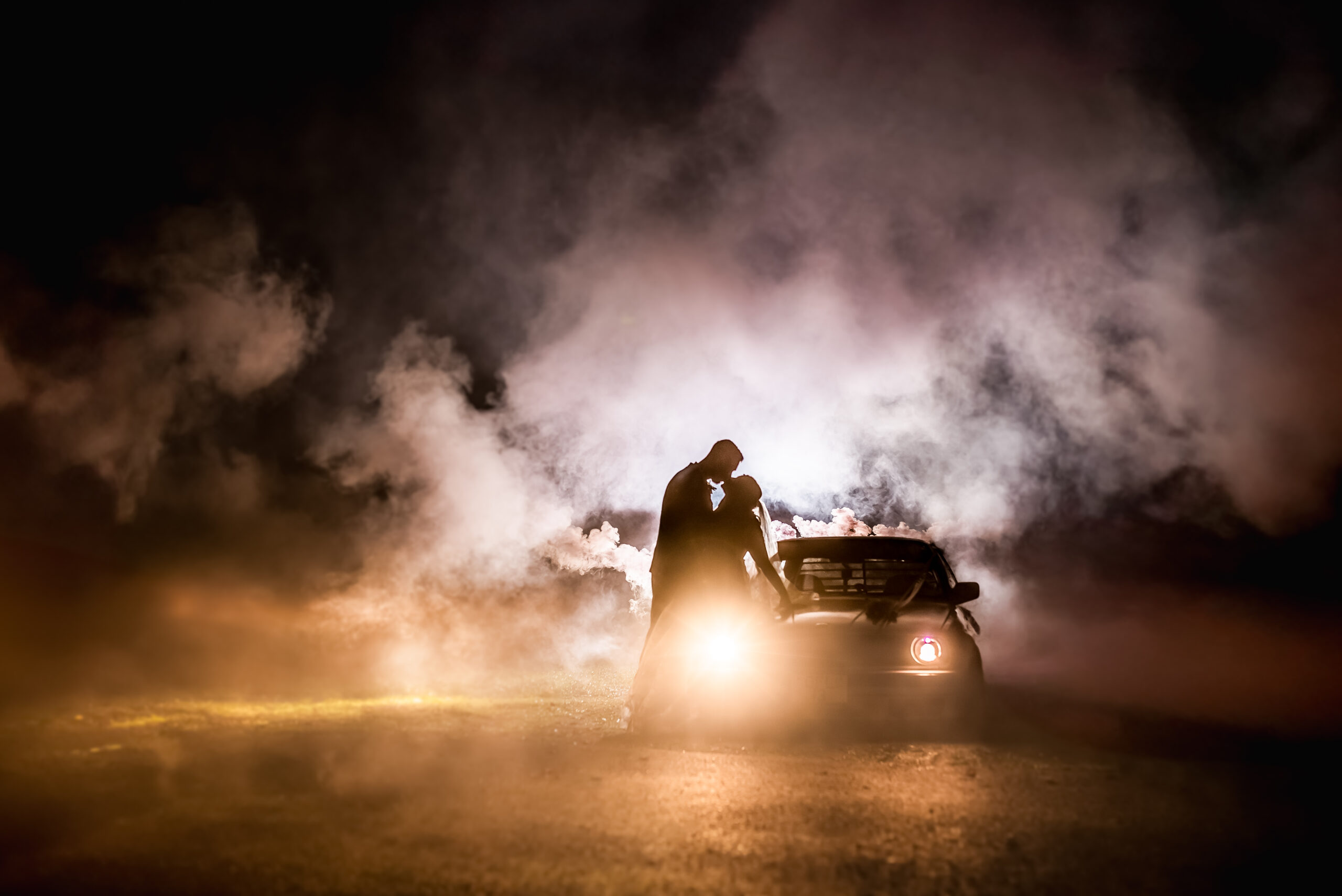 Epic wedding photography at the wroxeter hotel. Bride and groom smoke bombs and car