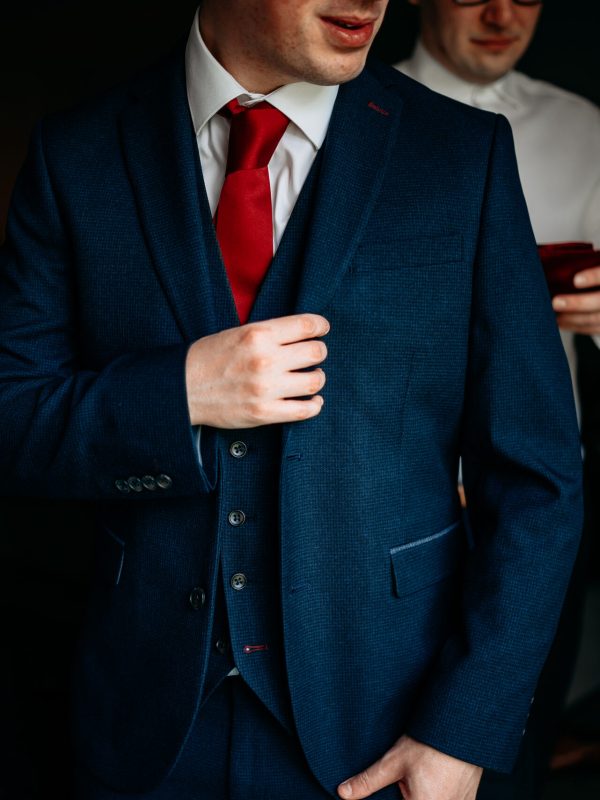 Groom getting ready at The Mill Barns, Shropshire – candid moment before the ceremony.