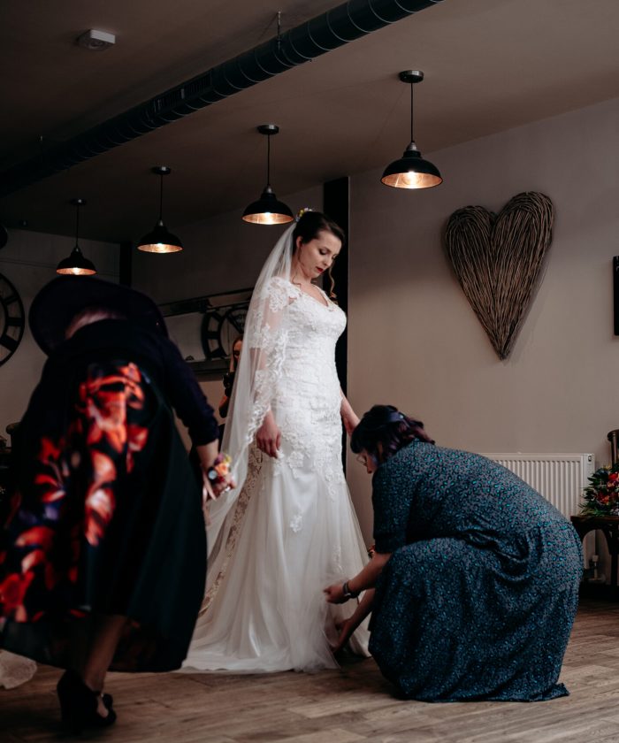 Bride getting ready at The Mill Barns, Shropshire – candid moment before the ceremony.