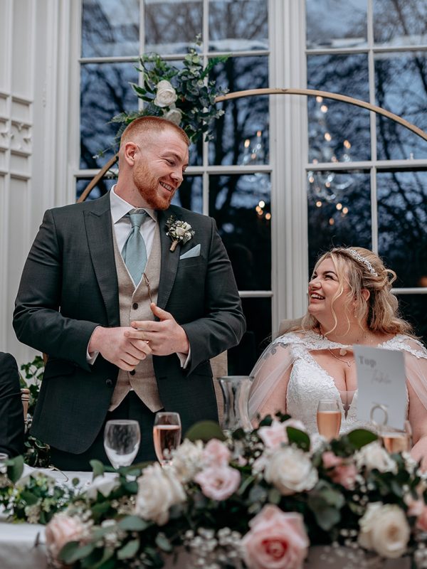 Groom laughing duringspeech at Rowton Castle wedding breakfast