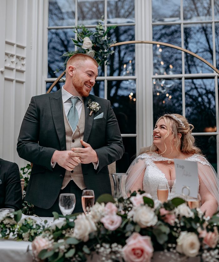 rowton castle wedding photography Groom laughing duringspeech at Rowton Castle wedding breakfast