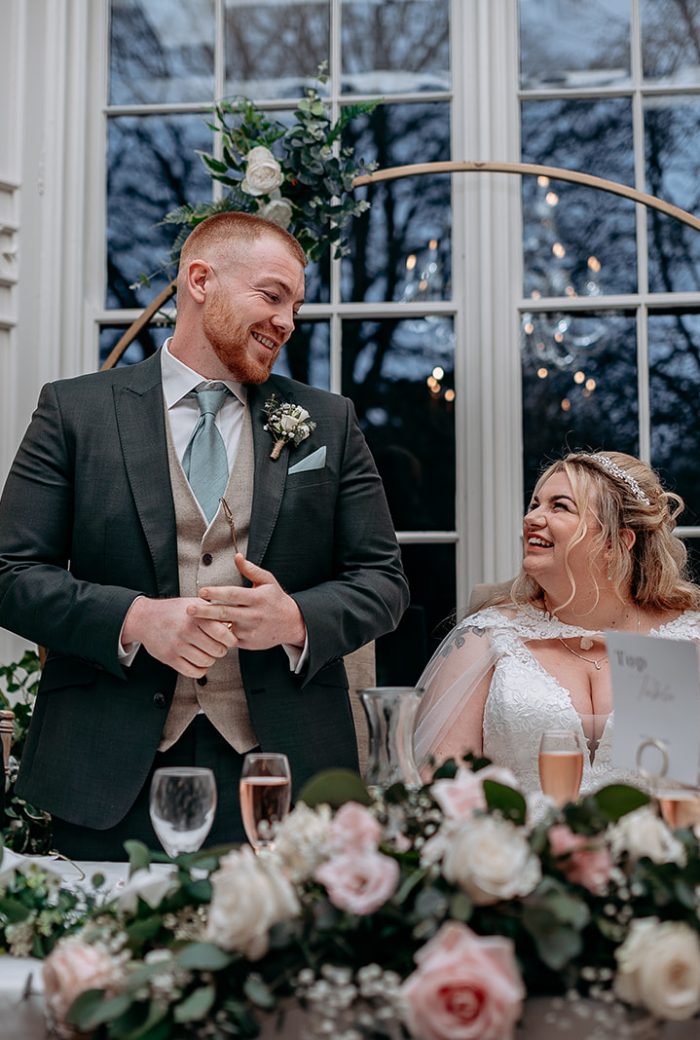 rowton castle wedding photography Groom laughing duringspeech at Rowton Castle wedding breakfast