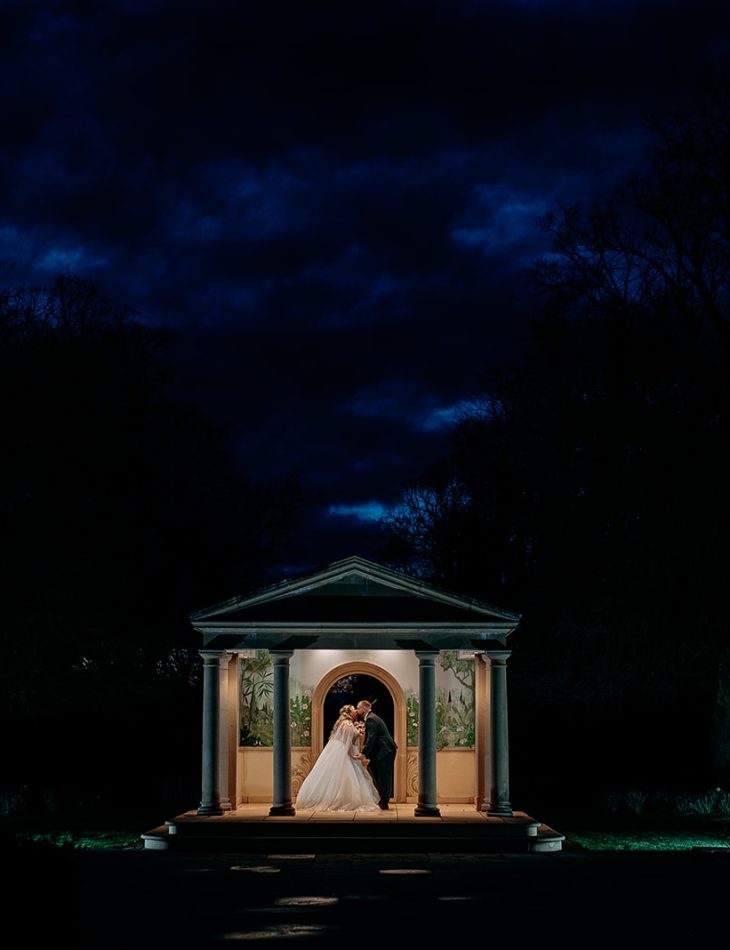 evening wedding portrait in Rowton Castle garden with couple