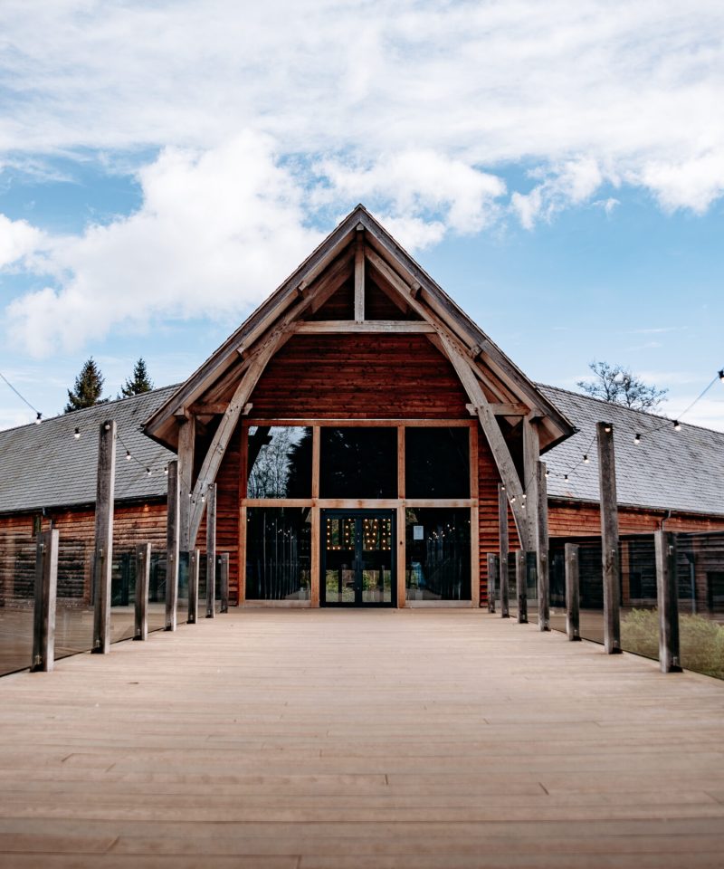 The Mill Barns Shropshire – rustic wooden barn wedding venue by the lake.