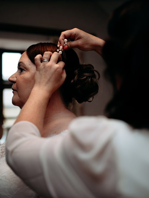 Bride getting ready with family at The Grain Loft wedding in Shropshire