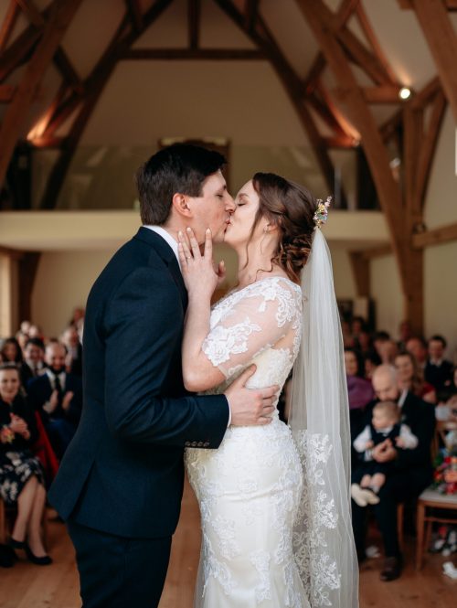Bride and groom first kiss ceremony at The Mill Barns