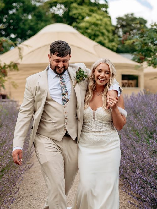 Bride and groom laughing candidly during countryside wedding in Staffordshire