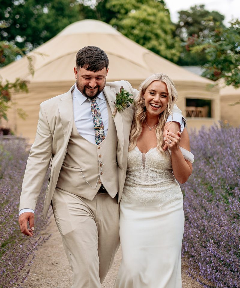 Bride and groom laughing candidly during countryside wedding in Staffordshire