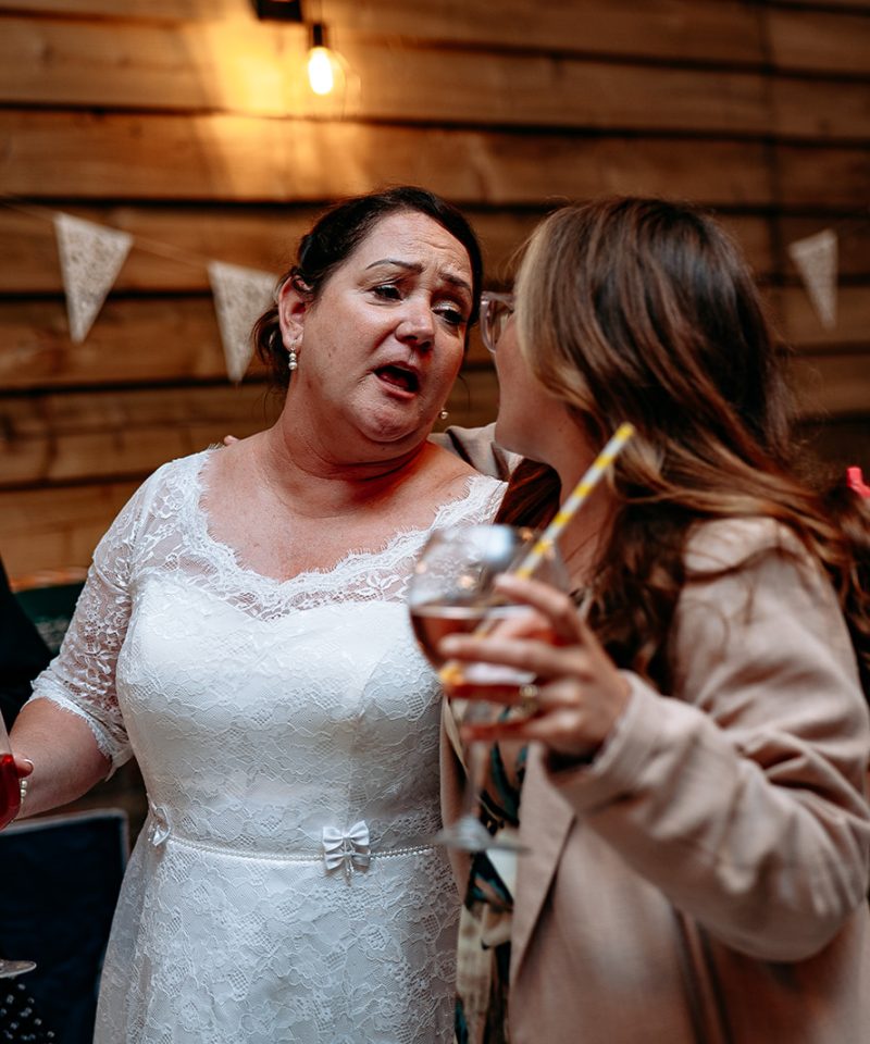 Candid moment of guests laughing during a relaxed wedding day