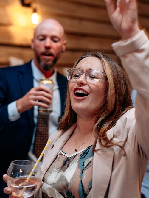 Candid moment of guests laughing during a relaxed wedding day