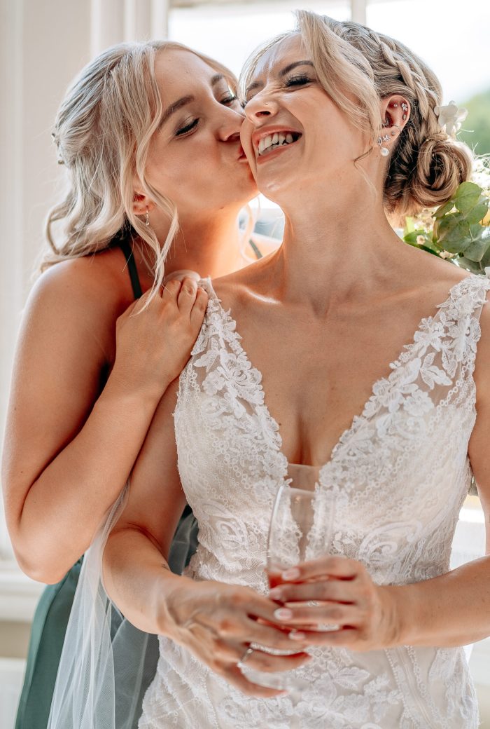 Emotional mother-daughter moment before wedding ceremony west midlands candid wedding - how far in advance to book wedding photographer