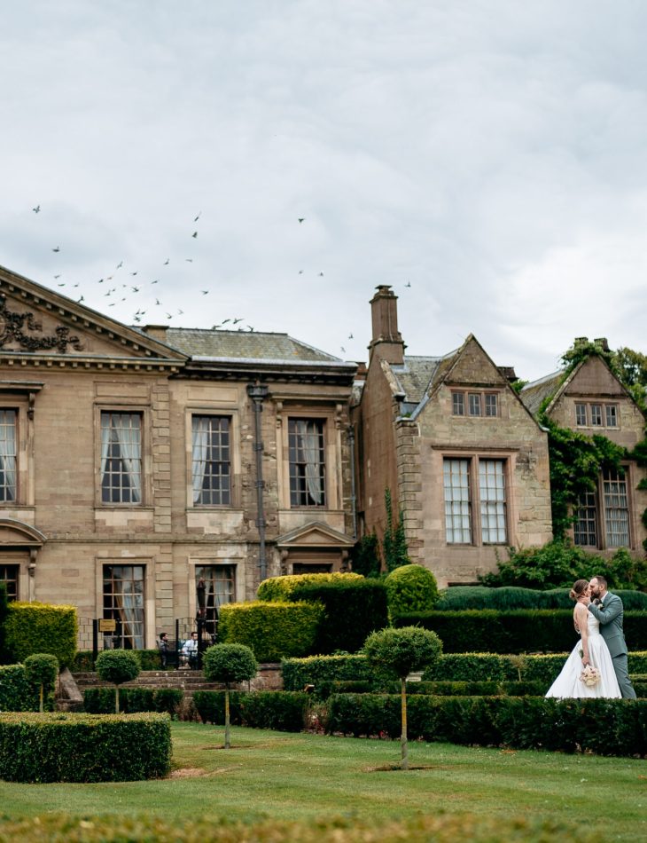 Bride and groom walking the grounds of a West Midlands wedding venue Coombe Abbey