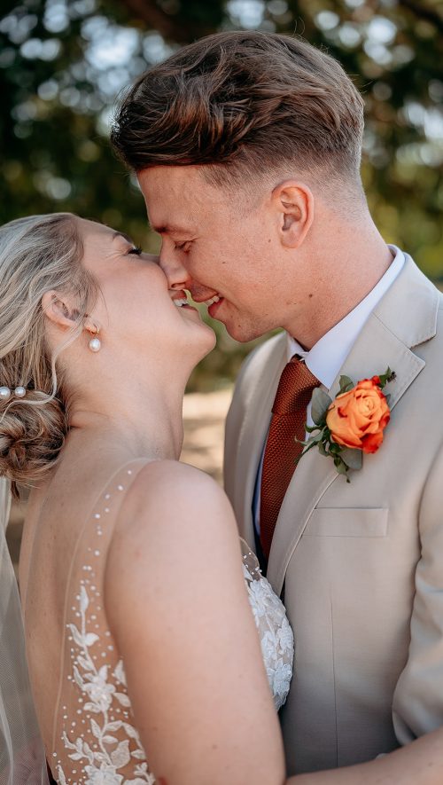 Wedding photographer West Midlands bride and groom kiss