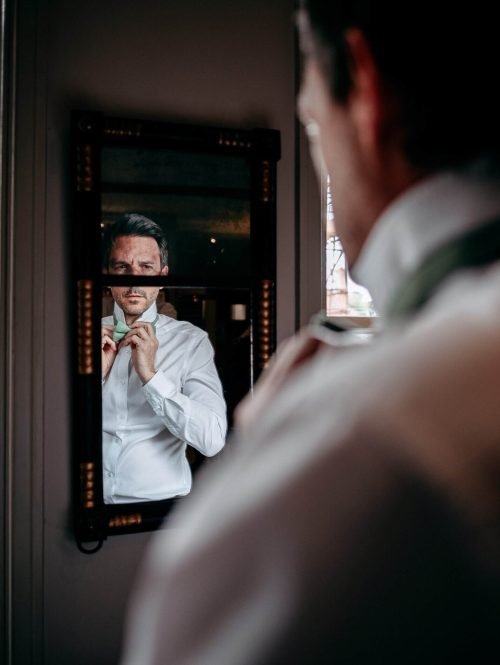 wedding photographer groom prep